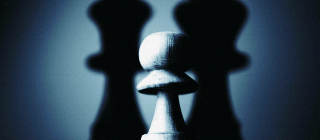 Chess piece with two shadows