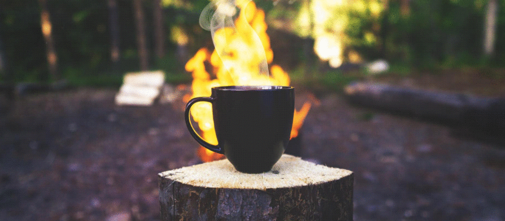Camp fire and coffee mug
