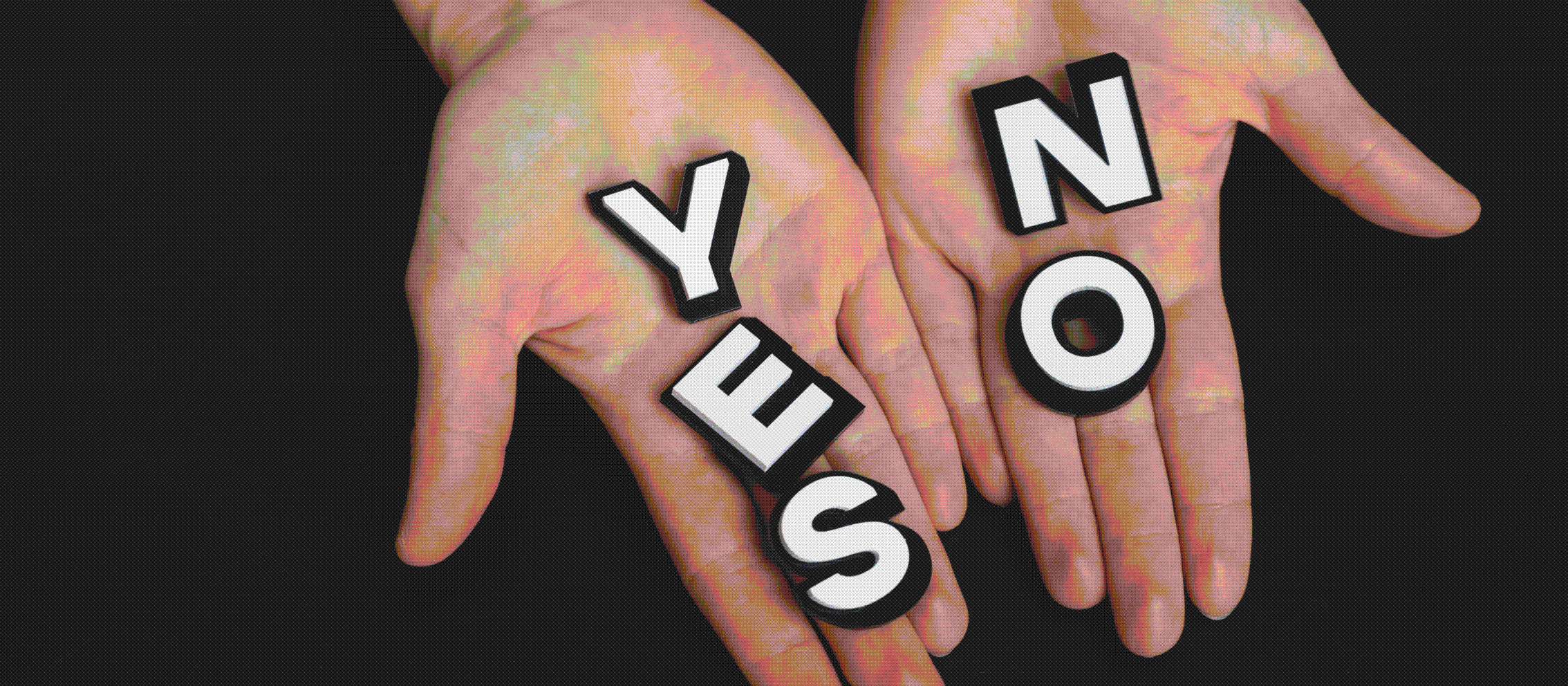 hands bearing yes and no