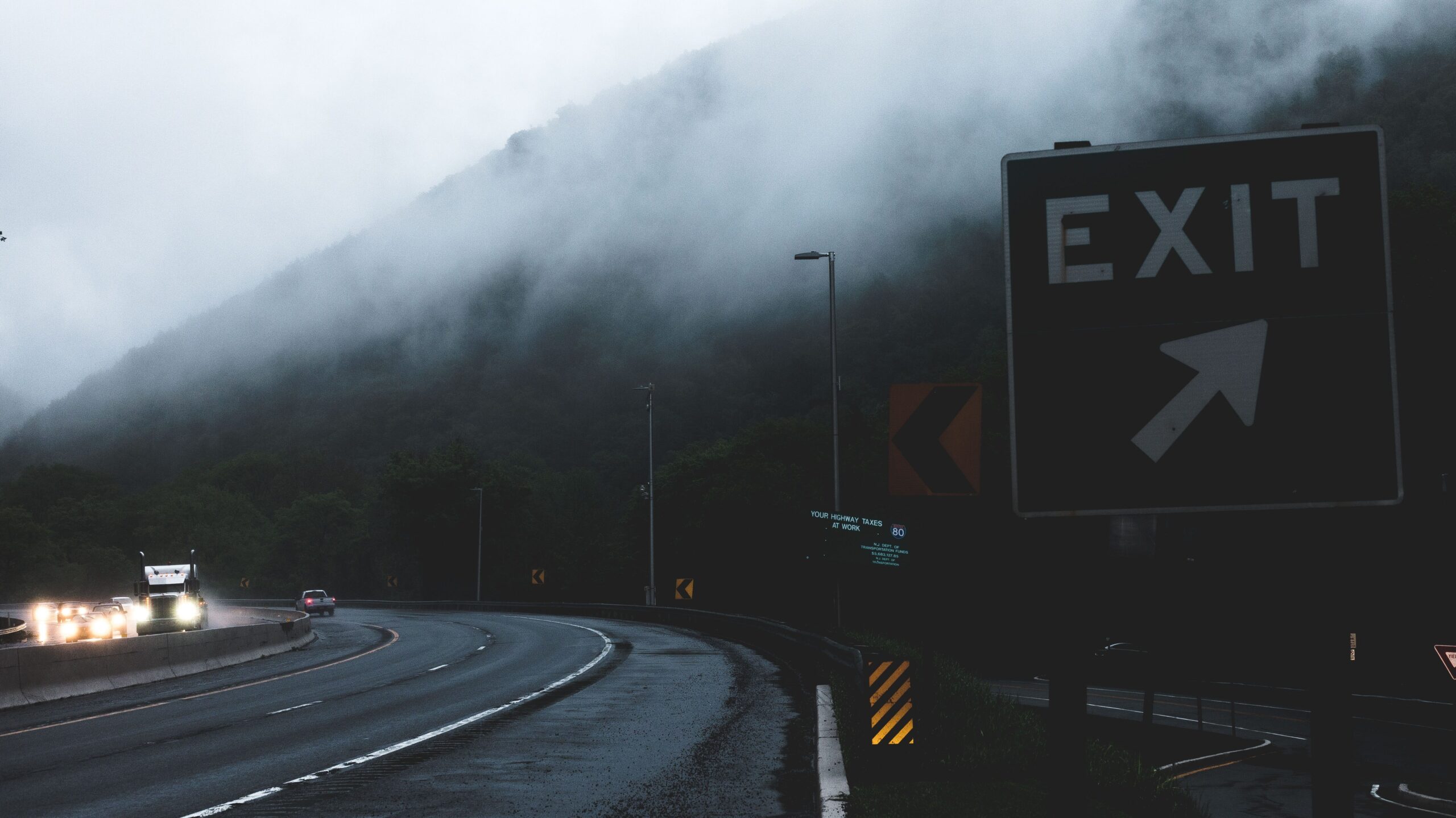 Misty Highway with Exit Sign